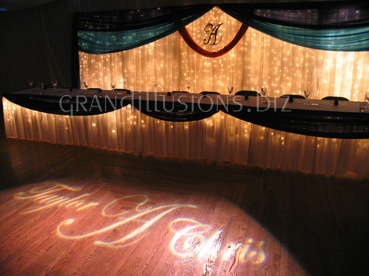 head table icicle backdrop initial letter gobo on floor wedding reception decorating Pla Mor Ballroom Lincoln Nebraska