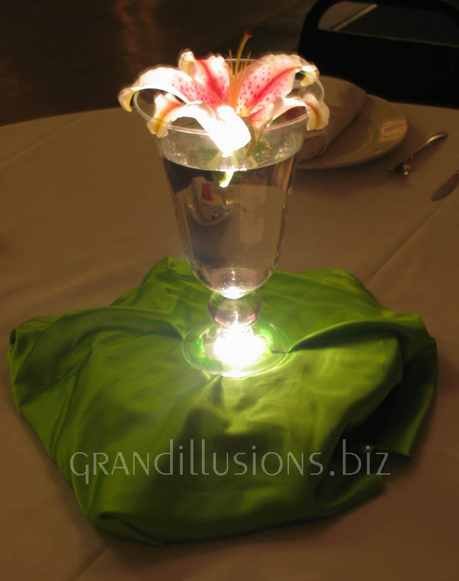 lit pink star gazer lily wedding centerpiece