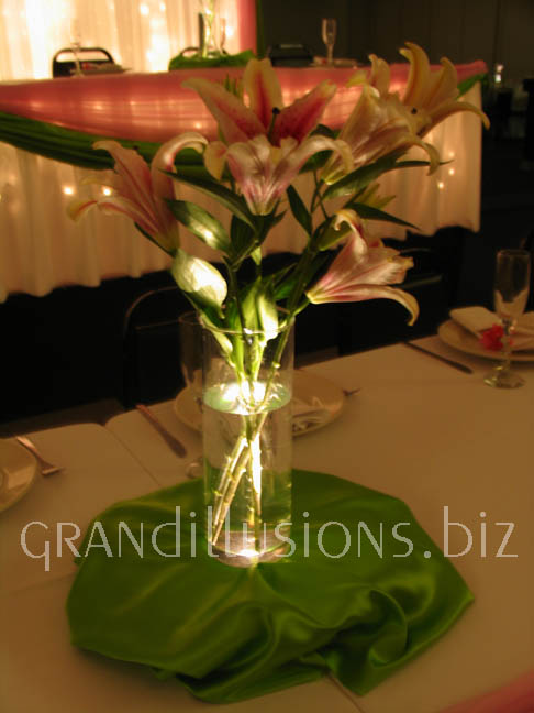 pink star gazer lillies on light box wedding centerpieces